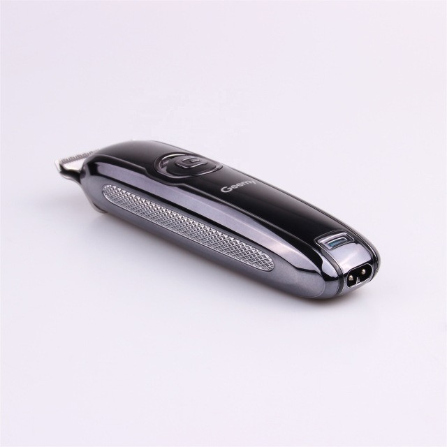 ماشین اصلاح موی سر و صورت جیمی مدل GM-6050، نمایشگر وضعیت باتری، منبع انرژی با برق، تکنولوژی اصلاح به صورت برش مستقیم، اندازه اصلاح 0.1 میلیمتر، بههمراه روغن، برس تمیزکننده