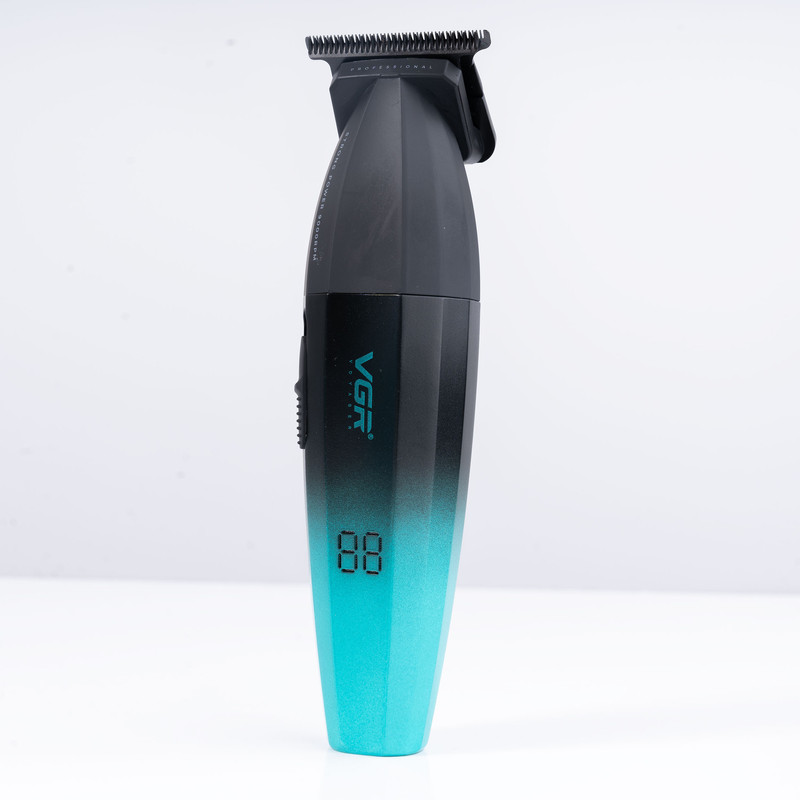 ماشین اصلاح موی سر و صورت وی جی ار مدل V-906، اصلاح به صورت صفر زن، خط زن، منبع انرژی باتری، تکنولوژی اصلاح به صورت تریمر، مدت زمان شارژ 150 دقیقه و مدت زمان استفاده پس از شارژ 240 دقیقه، به همراه کابل شارژ USB، برس تمیزکننده، روغن و محافظ، عملکرد توربو